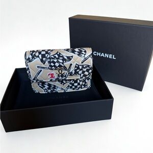 Chanel
Printed Nylon Wallet on Chain - Graphic Check Print
c. Microchip/2022